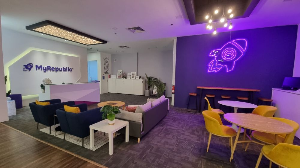 MyRepublic Broadband customer operations team in a modern open-plan office in Singapore.